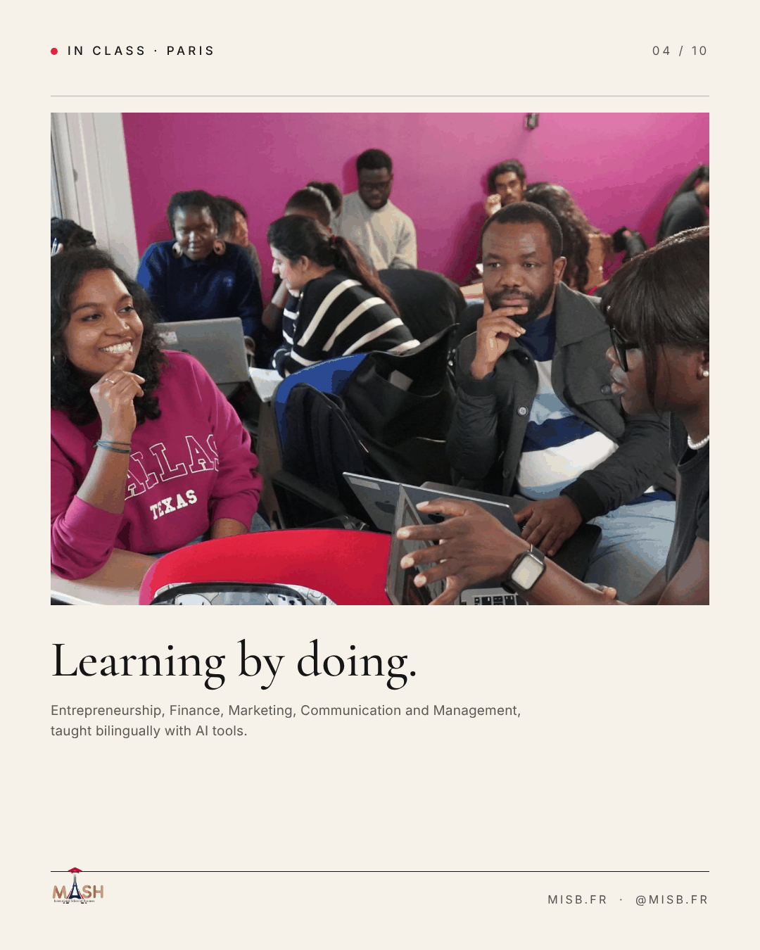 Students seated in a classroom with magenta walls, laptops open, smiling towards the front; headline "Learning by doing."